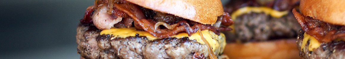 Eating American (Traditional) Burger Fast Food Hot Dog at Becks Prime restaurant in Sugar Land, TX.